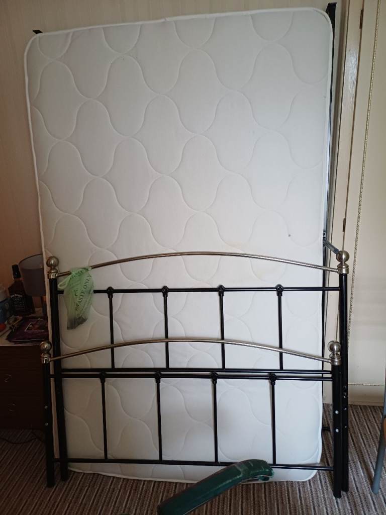 Snall double bed and mattress