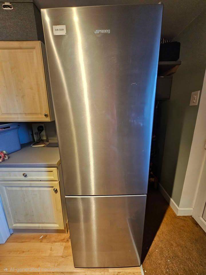 Smeg freestanding fridge/freezer model FC18EN1X. Total no frost.  H1860 x W595 x D650 mm. Like new
