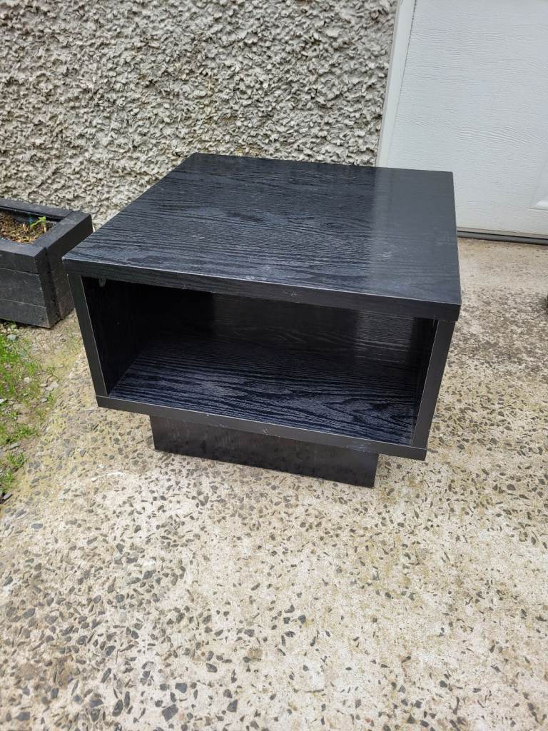 Argos small black wood effect game console / tv unit. Good condition.