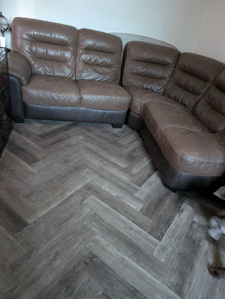 Brown leather corner sofa and arm chair