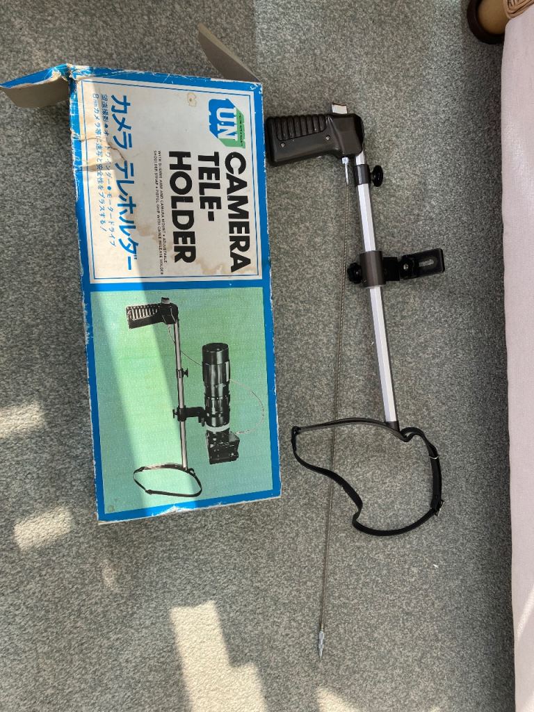 CAMERA TELE HOLDER