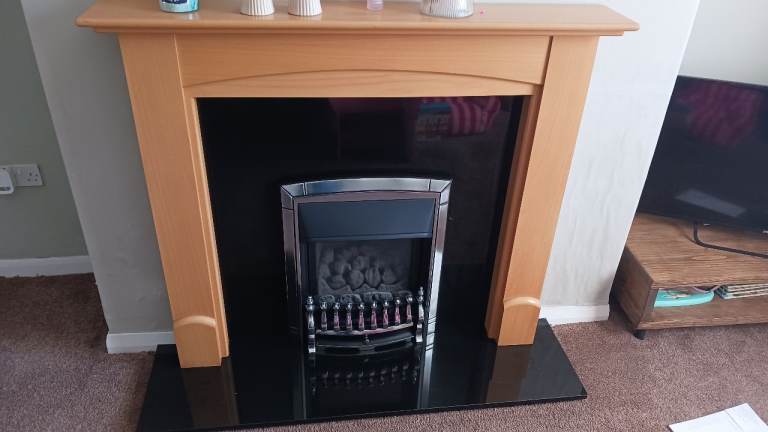 Wooden fire surround and Black Granite back and hearth