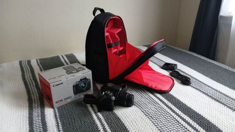 Canon EOS 2000D DSLR Camera in pristine condition with brand new camera bag and original box!