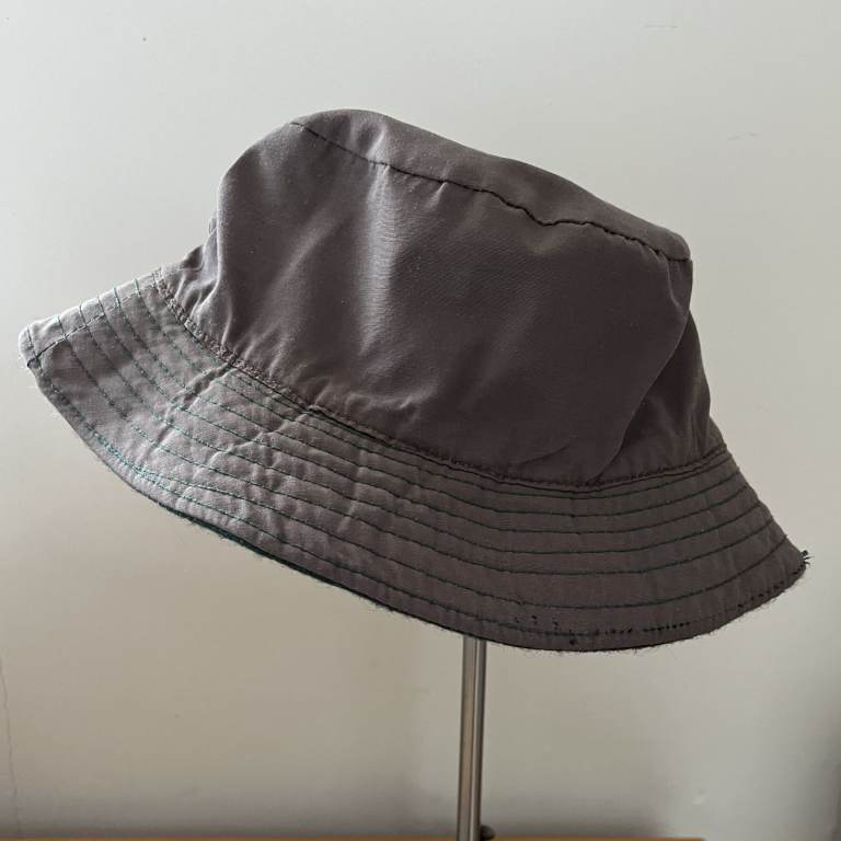 Reversible bucket hat. Showerproof, warm. Khaki/dark green wool-like fabric. Can post.