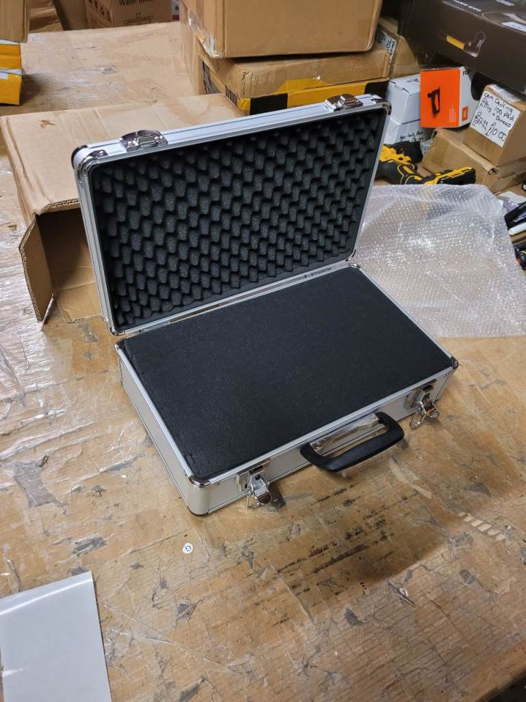 A new aluminium flight case it is lockable the measurements are 40cms 