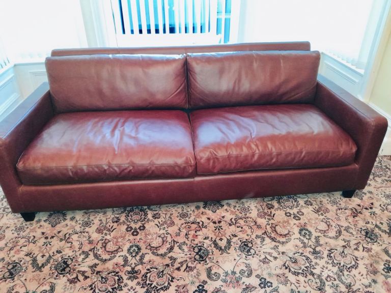 DRASTICALLY REDUCED Rustic, tan/ brown leather sofa.