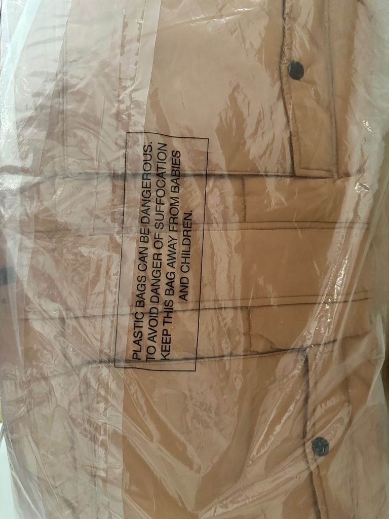 Brand new ladies coat in original packaging (from studio) size 24 toffee colour