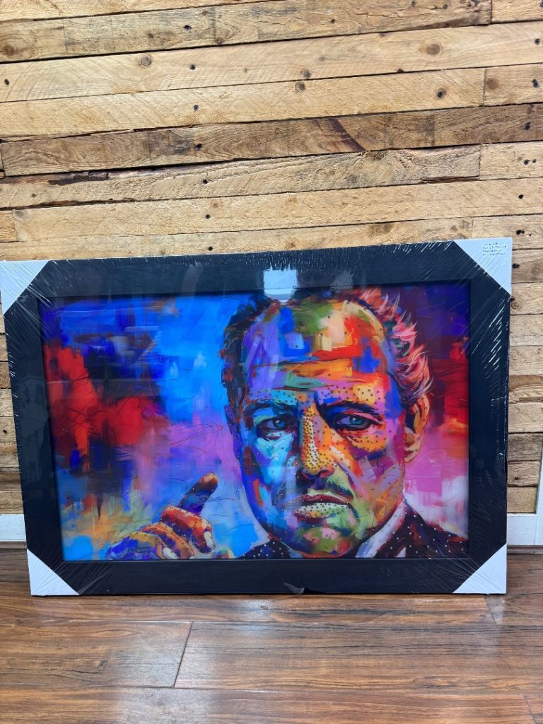 Description A Glass Art Picture of the Godfather with crystal embellishment in a black frame. 