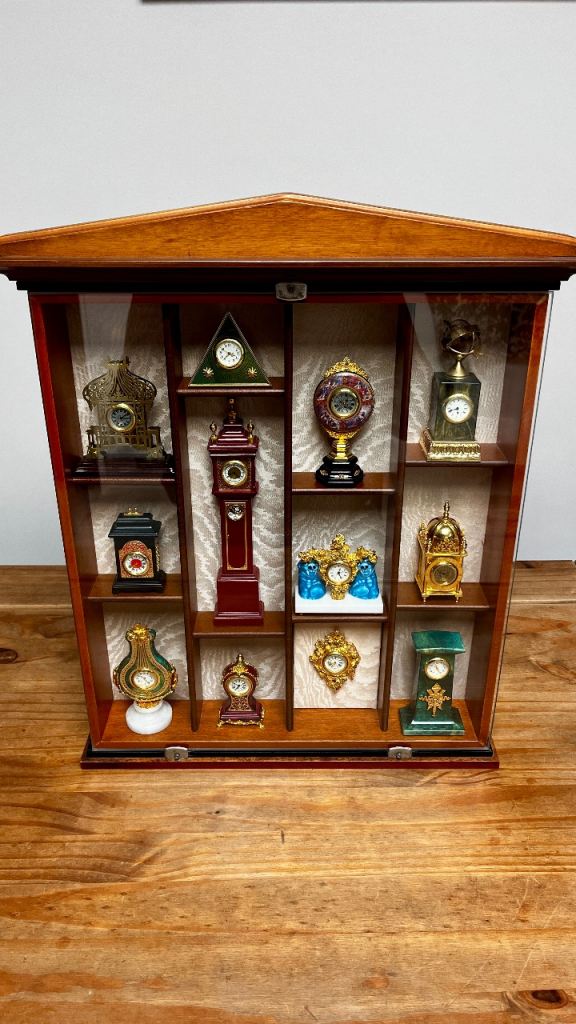Selection of 12 Miniature Clocks in Display Cabinet ATHENS COLLECTIONS 1998