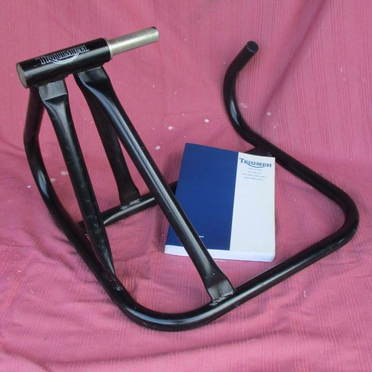 genuine Triumph motorcycle paddock stand and original workshop Service Manual Daytona Speed Triple 