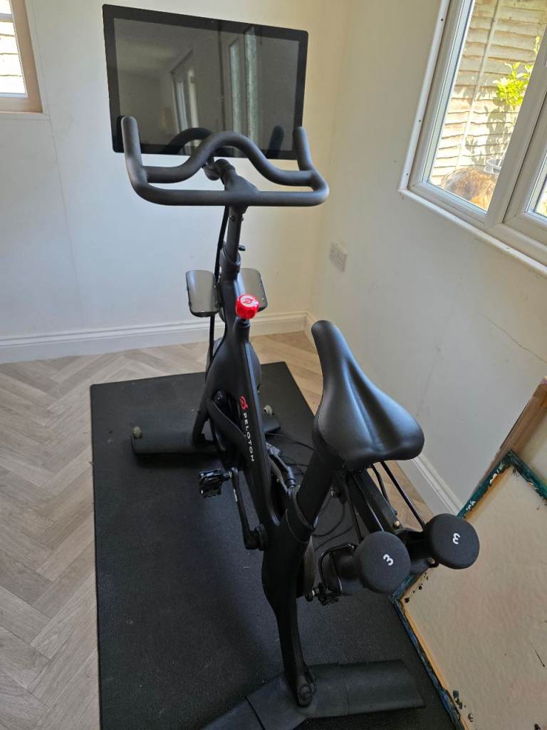 Peloton exercise bike with mat