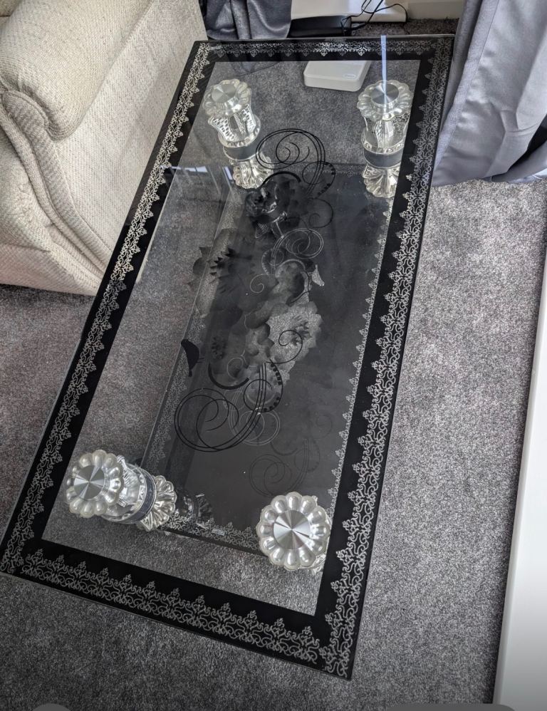 Stylish Glass Coffee Table with Black and Silver Details