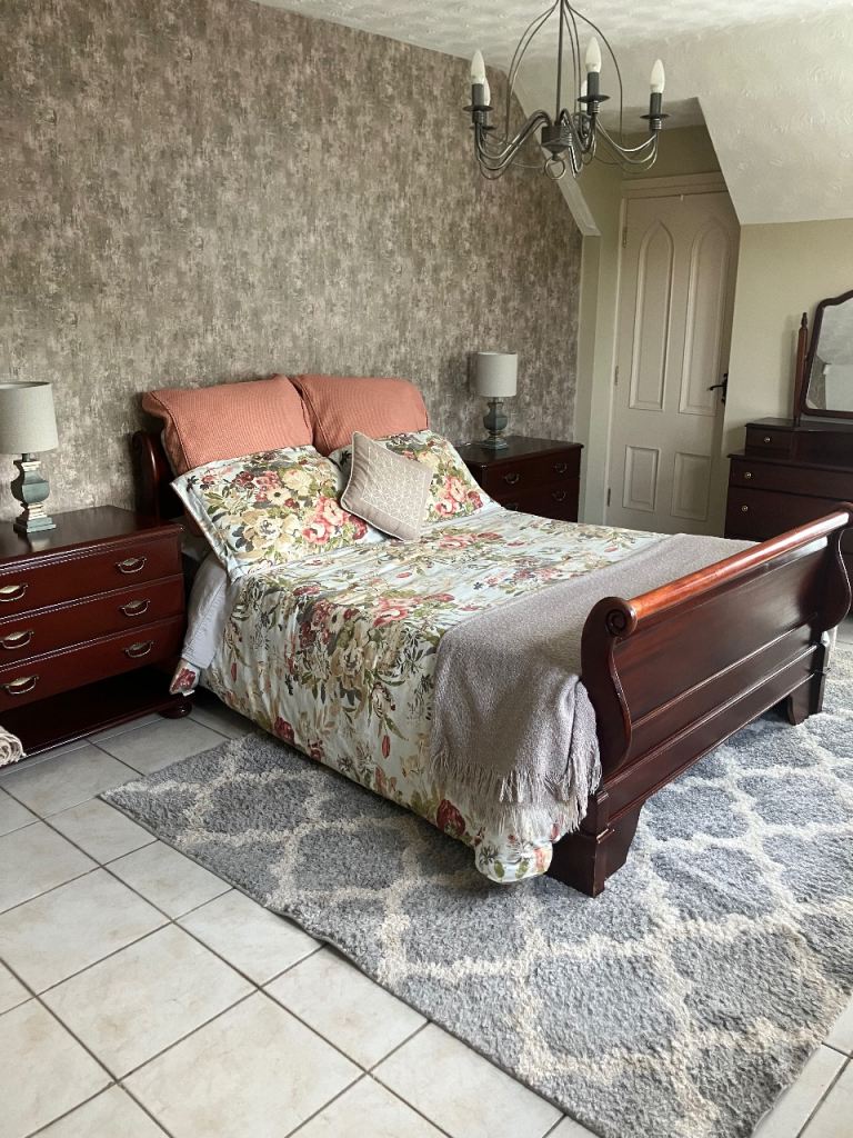 Mahogany sleigh bed and side tables