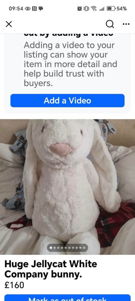 Huge Bunny Jellycat and three black sacks of clothes and some shoes. 