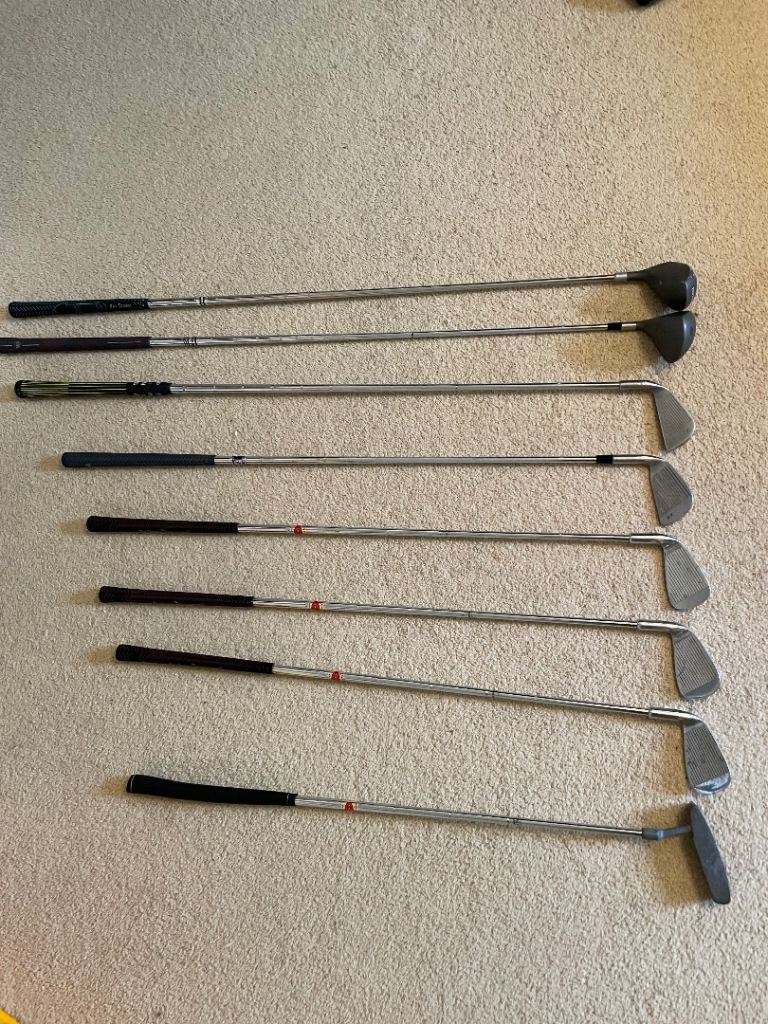 Assorted golf clubs