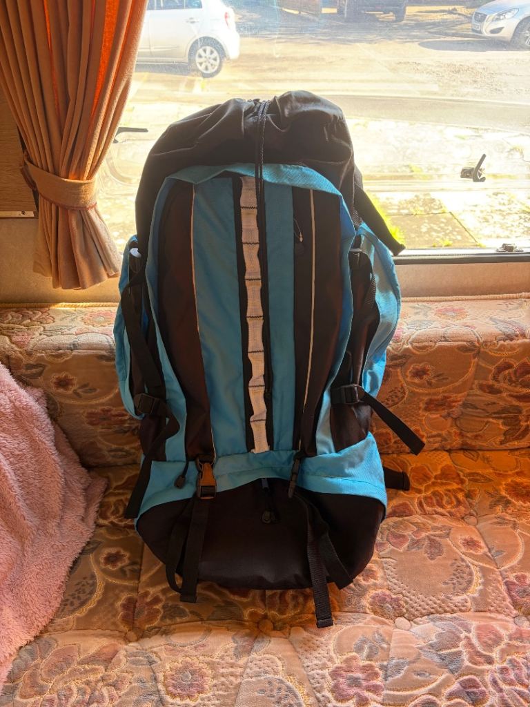 The vidaXL Hiking Backpack XXL 75L is a blue and black polyester rucksack with a 75-liter capacity. 