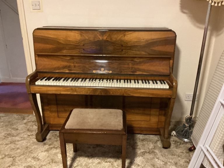 My well loved overstrung upright grand piano, with piano stool.
