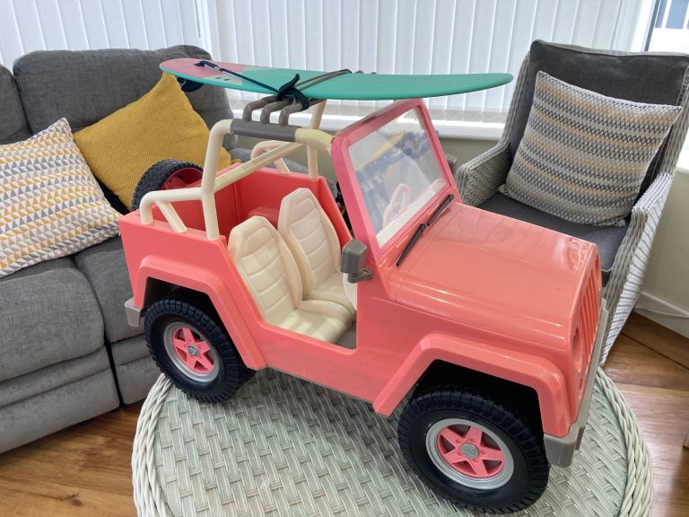 Our Generation 4x4 jeep with surfboard and rack 