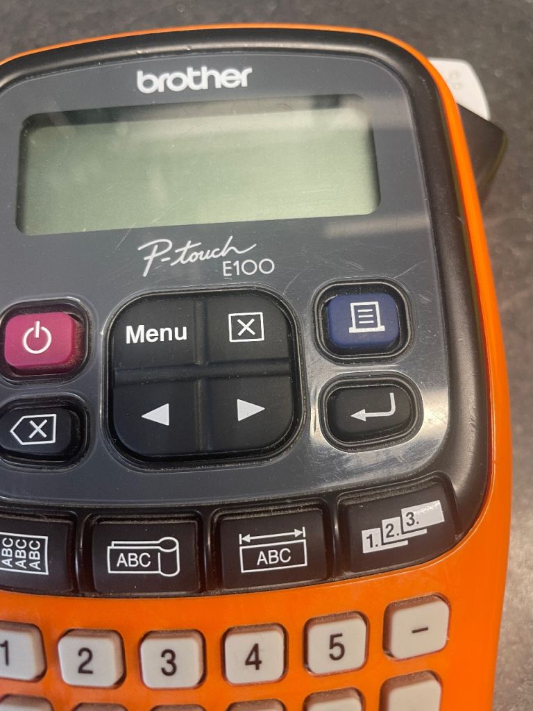 Brother P-touch E100 Label Maker – Orange & Grey, Good Condition