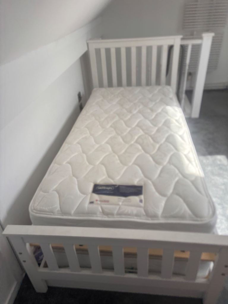 White single bed and pull out trundle 