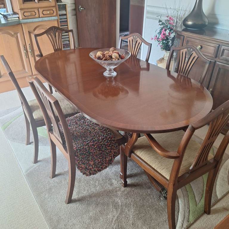 Mahogany extending dining table and 6 chairs