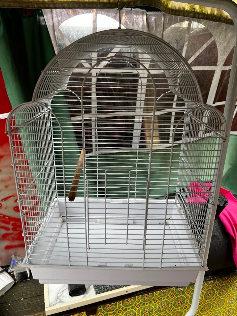 White metal and plastic birdcage with hanging stand