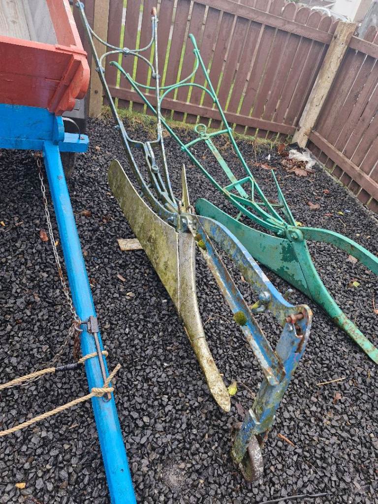 Donkeys kart and two ploughs