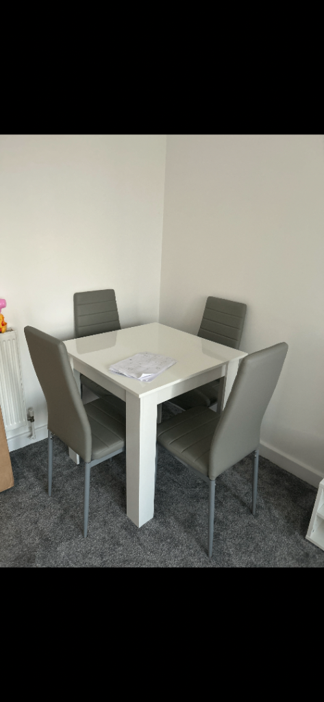 4 light Grey dining Chairs (new in box) as was sent two out 