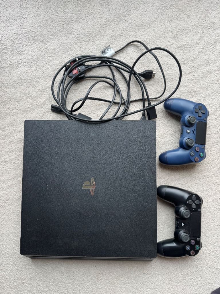 PS4 Pro console, controllers and 9 games