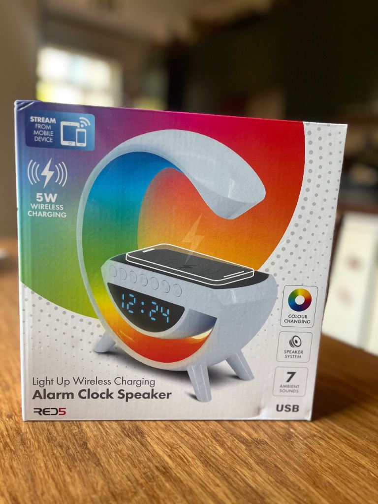 Light up wireless alarm clock + Bluetooth speaker and bedside charging dock  