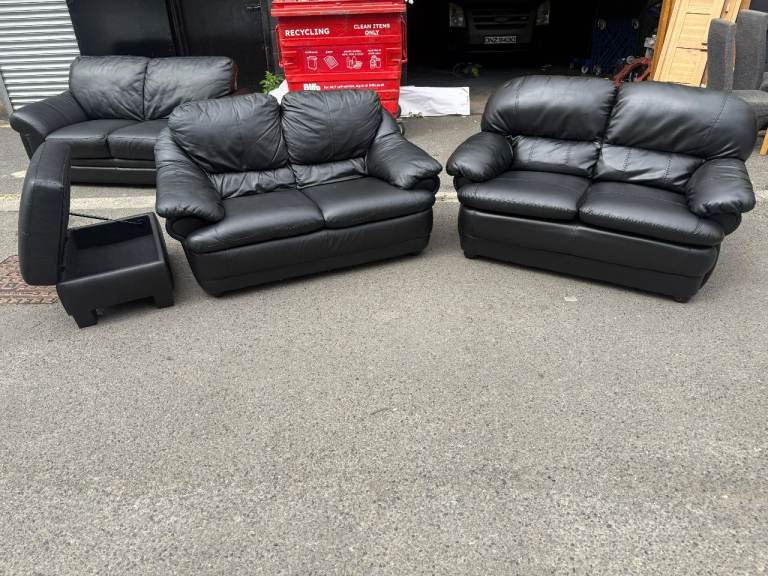 2 2 seater sofa in black leather and ottoman  footstool £275
