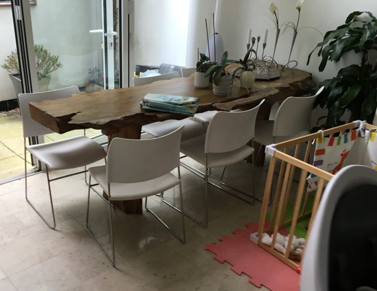 Beautiful large wangee/live edge padauk hardwood statement dining table. Seats 6/8