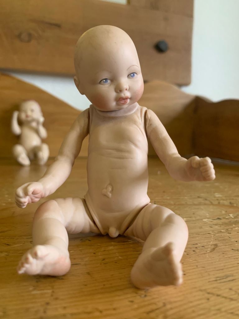 2 vintage dolls, 1 from 1985, 1 eatlier bisque doll