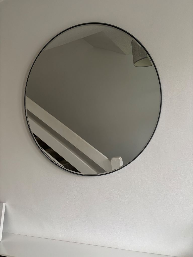 Grey round wall mirror 