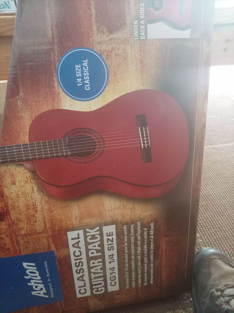 Ashton classical guitar, 1/4 size, still in its original box.