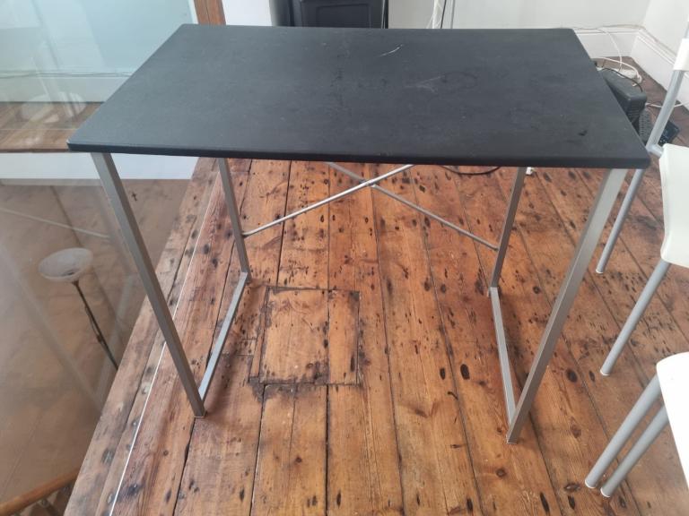 Small black table with metal frame