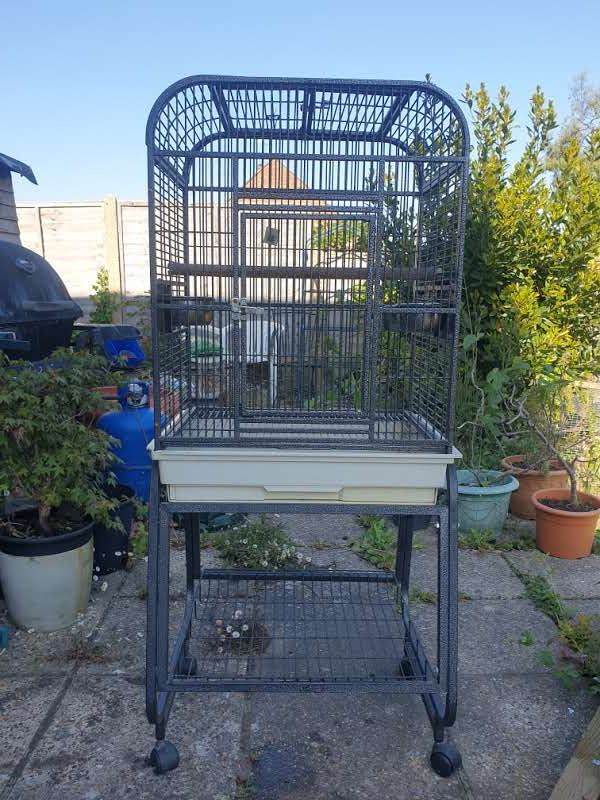 Large bird cage on moveable stand