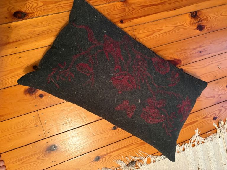 Dark Grey Cushion with Red Embroidered Design – Good Condition