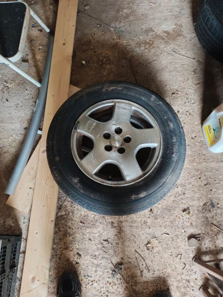 4 x 15ins Subaru Outback wheels and Space Saver Wheel.