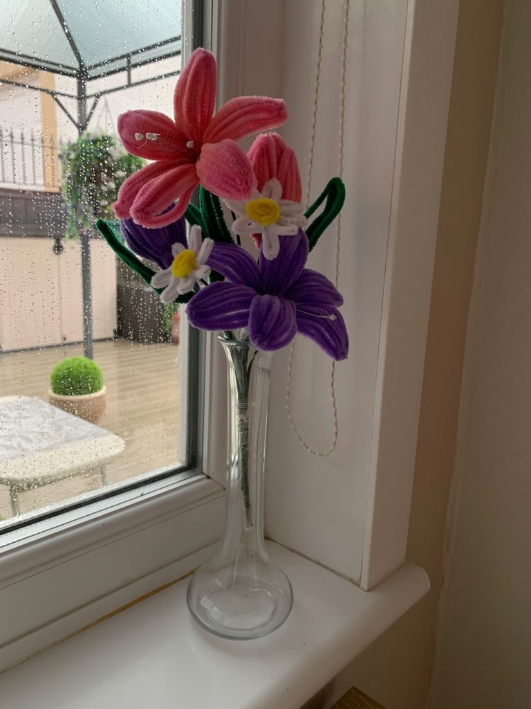 Hand made flowers and glass vase.