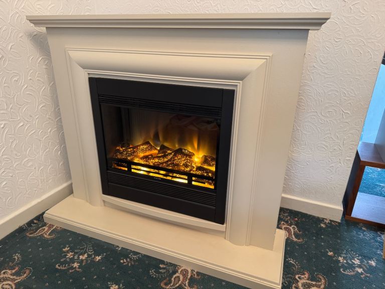 Cream fire surround with electric fire