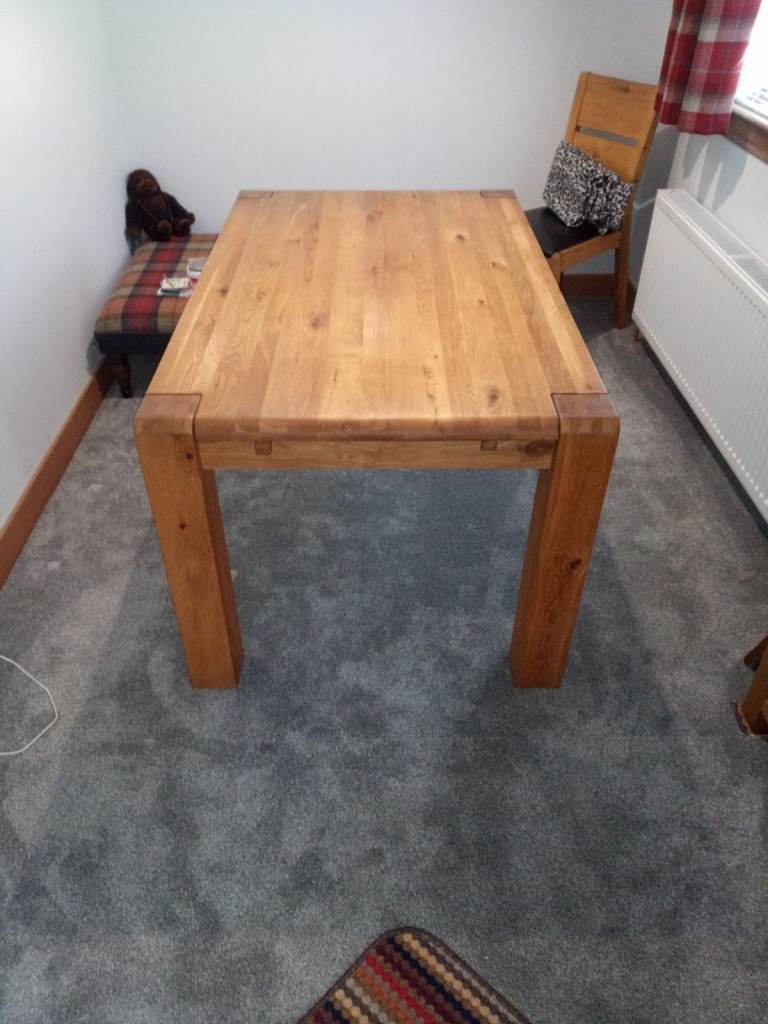 Ercol Solid Oak extending dining table and 4 chairs