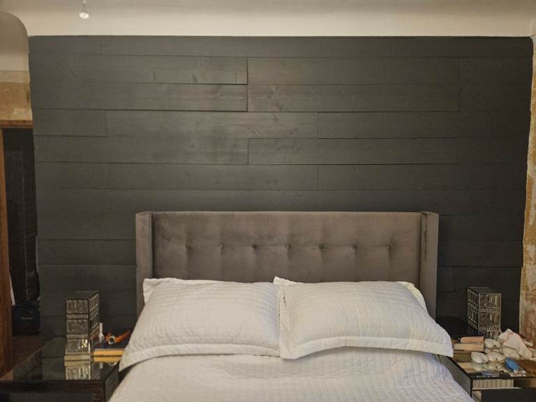 Some dark grey wooden wall planks that was used for a bedroom feature wall