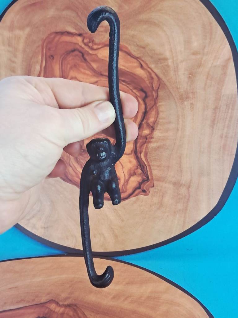 This is a cast iron monkey hook. It is a traditional Japanese household item.