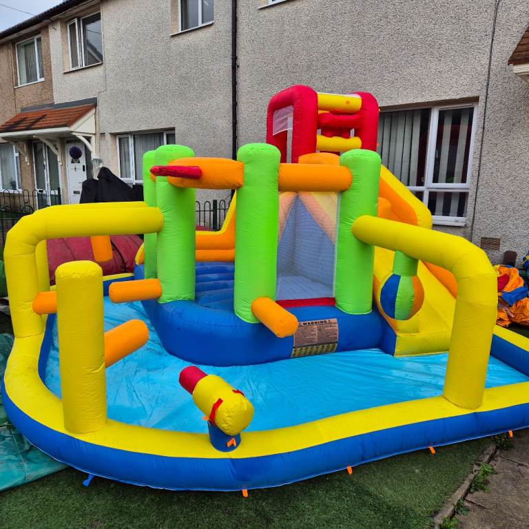 4 in 1 Waterslide Bouncy Castle + Delivery.
