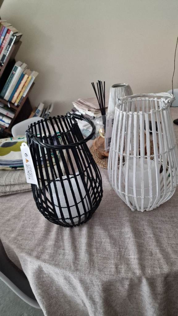 2 wicker black and white lanterns