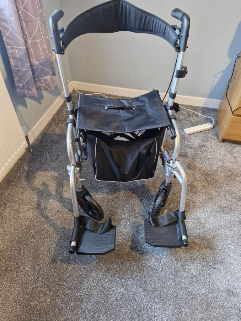 Walking aid with seat and removable foot rests