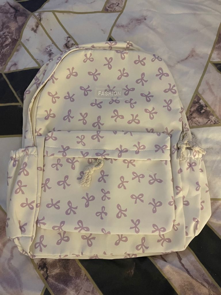 White/Cream backpack with purple bows