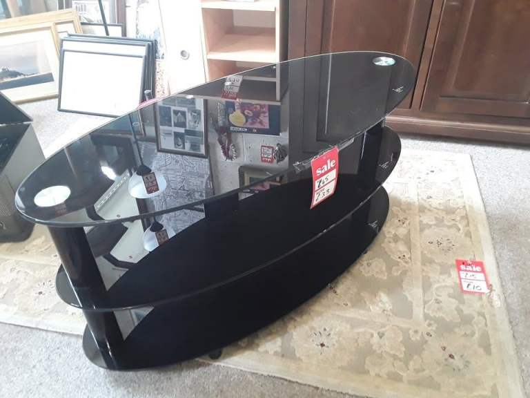 Oval black glass tiered TV stand Copley Mill Low Cost Moves 2nd Hand Furniture STALYBRIDGE SK15 3DN