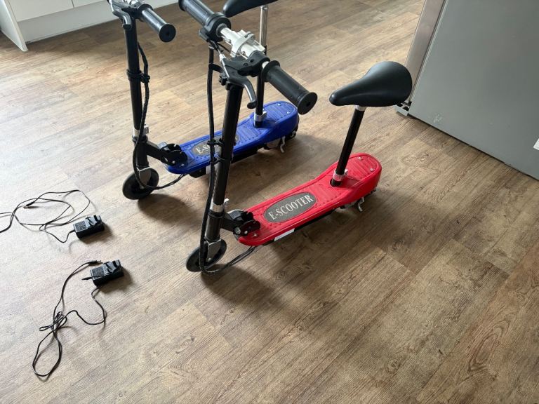 Pair of Electric Scooters with Seats – Blue and Red, Good Condition